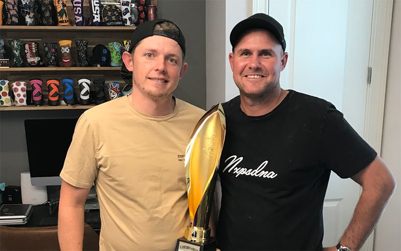 sam-pinfold-cam-smith-feature Cam Smith & Sam Pinfold in Hawaii with the Sony Open Trophy which Smith won in January (Supplied)